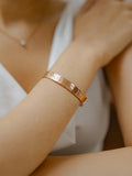 Handslegið kopararmband